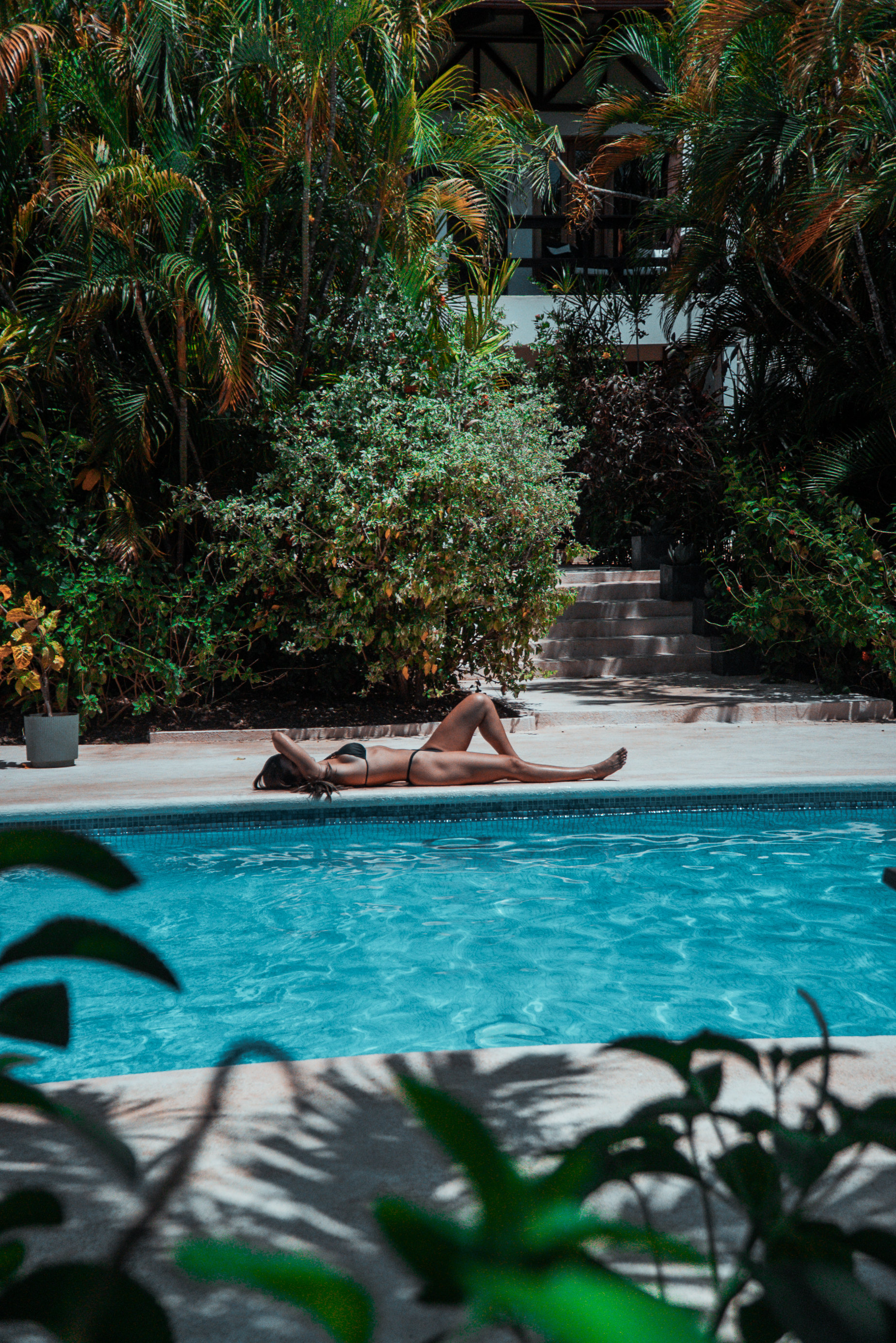 Woman by the pool at Villa del Sol Playas del Coco COsta Rica