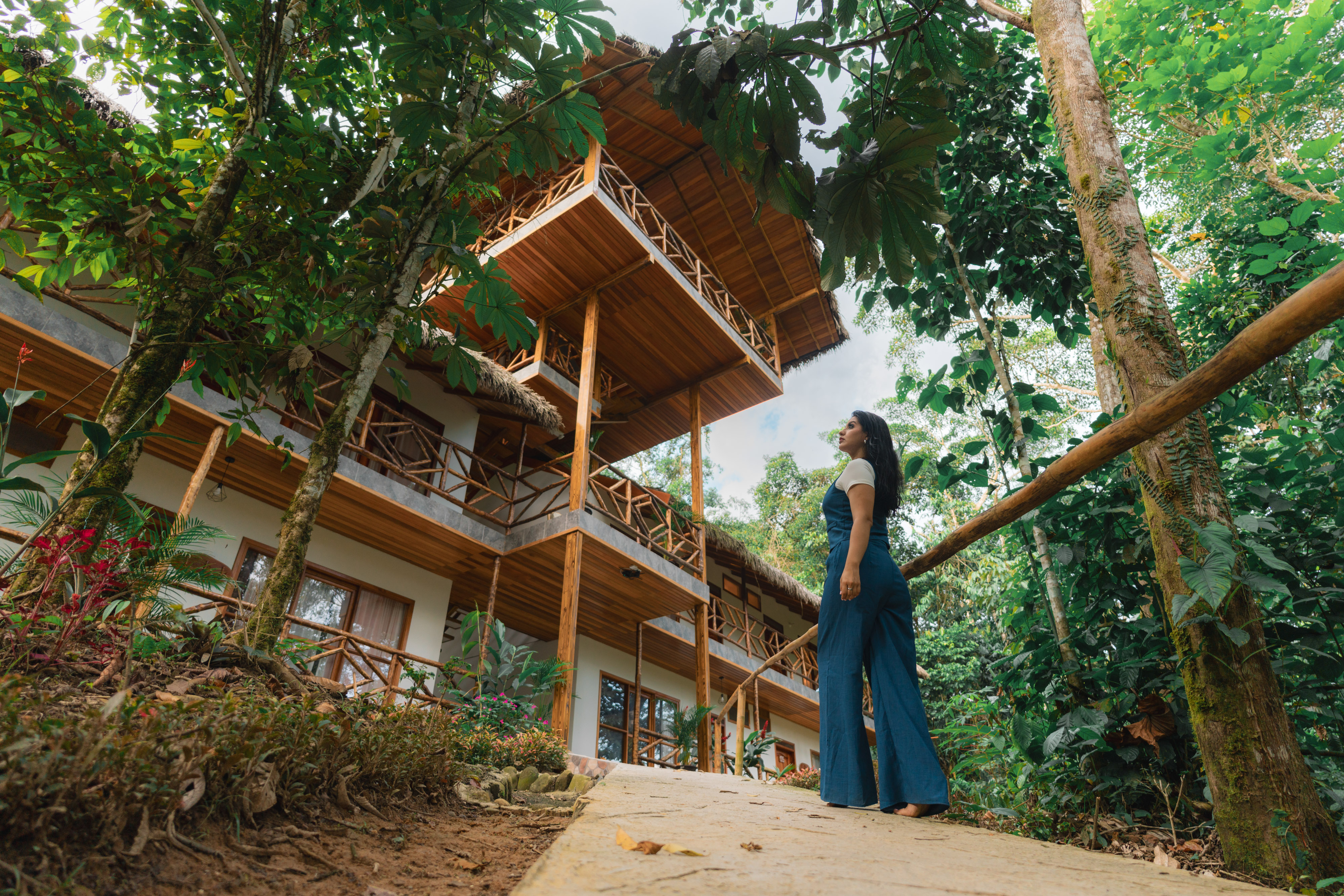 strategically located high up to provide breathtaking views of the surrounding rainforest. Whether it's the vibrant hues of the sky at dawn or the enchanting twilight colors, you can savor these awe-inspiring moments from your own private balcony, drink in hand. The suite boasts a comfortable sleeping area featuring a king-sized bed, sofas, and a spacious bathroom complete with a bathtub.